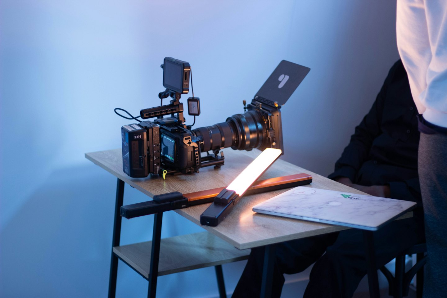 Professional video production equipment set up on a desk.